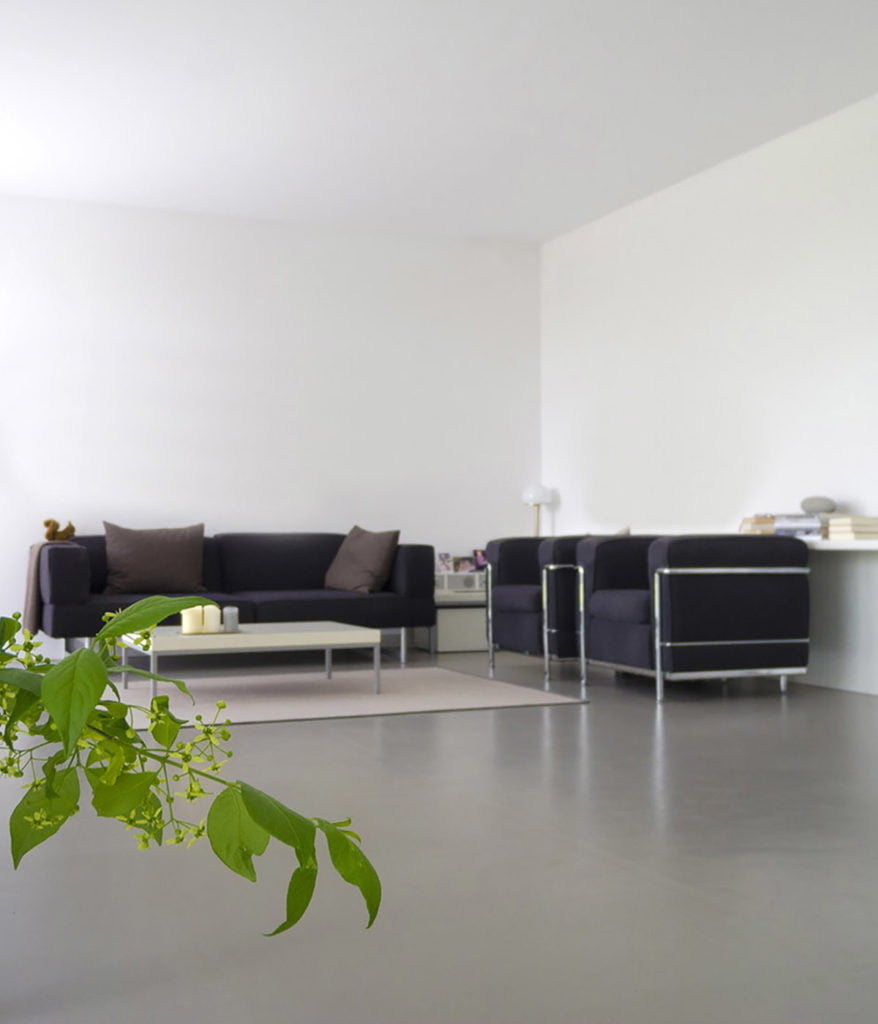 Open plan modern room inside a lounge, showcasing a polished floor screed